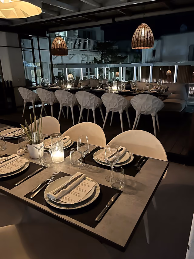 Candlelit group dining tables overlooking the Krama terrace