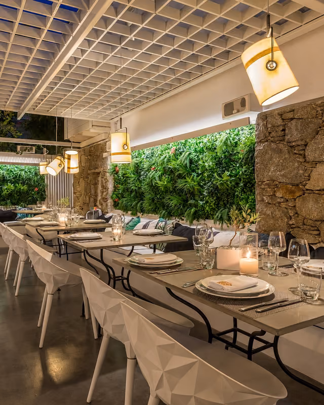 Krama garden dining terrace prepared for an evening celebration