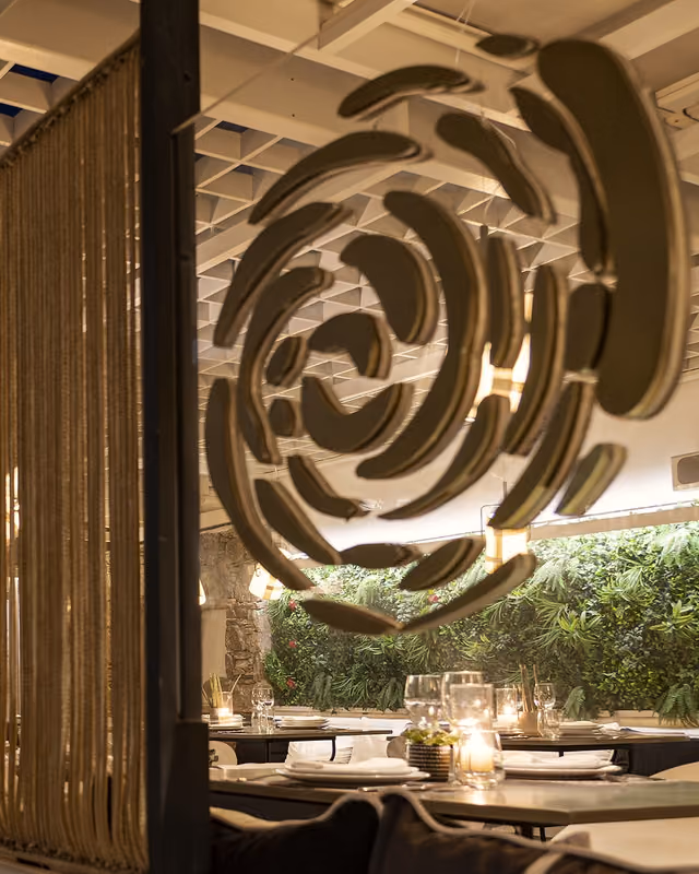 Krama rose emblem displayed against the restaurant's stone wall