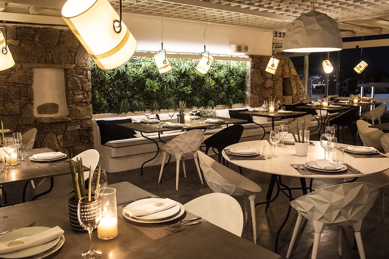 Warm candlelit dining area suitable for a semi-private Krama event