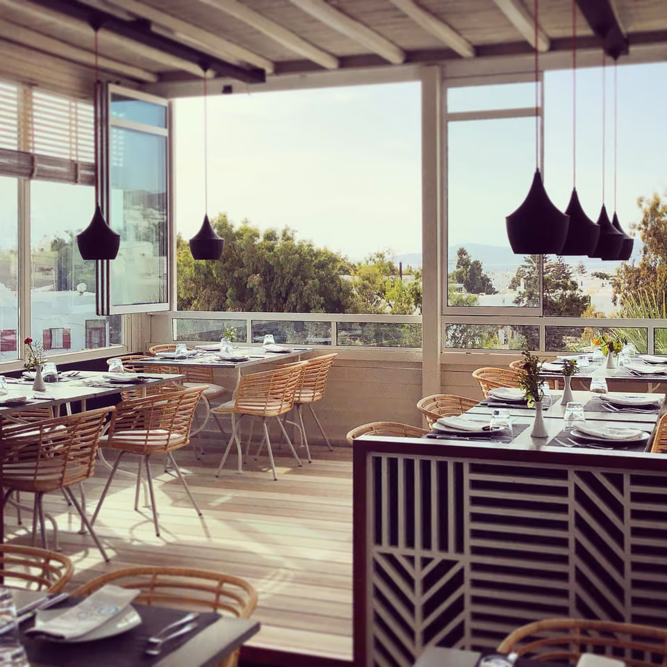 Thioni restaurant's terrace over the rooftops of Mykonos Town
